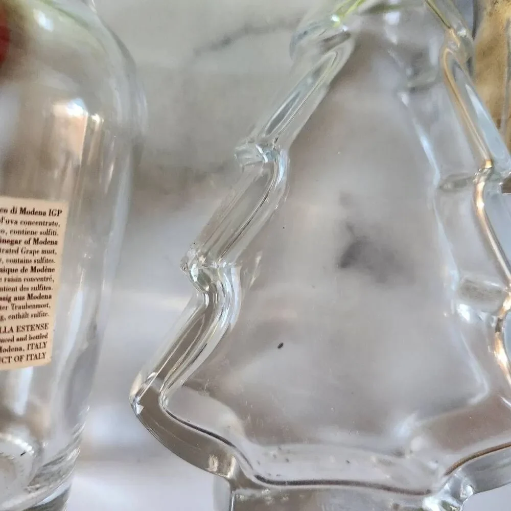 Woven wicker round basket handles various clear glass bottles vintage spice pine